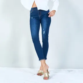 Distressed high-waisted skinny jeans with rolled hem wholesale