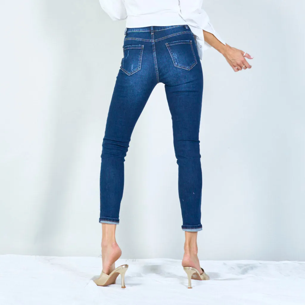 Distressed high-waisted skinny jeans with rolled hem wholesale